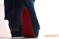 Close-up view of woman`s blue boots walking downstairs Royalty Free Stock Photo