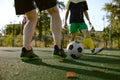 Closeup football player playing ball during training match on field