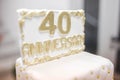 Closeup of a forty anniversary golden writing on a cake