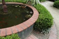 Closeup of fountain with orange goldfish and murky water Royalty Free Stock Photo