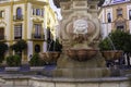 Closeup of a fountain in the square of Virgen de los Reyes and the Archbishop Palace - one of the landmarks of the city of Seville Royalty Free Stock Photo