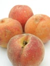 Closeup Four peaches on white background Royalty Free Stock Photo