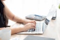 Closeup freelance asian woman working and typing on laptop computer at desk office with professional Royalty Free Stock Photo