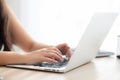 Closeup freelance asian woman working and typing on laptop computer at desk office with professional Royalty Free Stock Photo