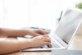 Closeup freelance asian woman working and typing on laptop computer at desk office with professional Royalty Free Stock Photo