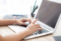 Closeup freelance asian woman working and typing on laptop computer at desk office with professional Royalty Free Stock Photo