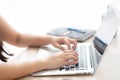 Closeup freelance asian woman working and typing on laptop computer at desk office with professional Royalty Free Stock Photo