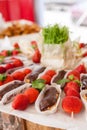 Closeup of french dessert lemon and chocolate Eclair with strawberries. Royalty Free Stock Photo