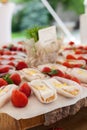Closeup of french dessert lemon and chocolate Eclair with strawberries. Royalty Free Stock Photo