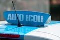 french driving school panel on the car roof , text in french Royalty Free Stock Photo