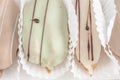 Closeup of french eclairs in color glaze