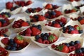 Closeup of fresh berries for dessert - raspberries, strawberries, blueberries, red currant