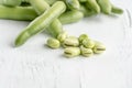 Closeup fresh broad beans on a wooden table Royalty Free Stock Photo