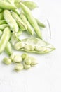 Closeup fresh broad beans on a wooden table Royalty Free Stock Photo