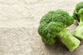 Closeup fresh broccoli on sackcloth background, raw food for cooking