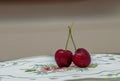 Closeup of fresh cherries with waterdrops on a plate