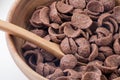 Closeup fresh cocoa cereal on wooden bowl