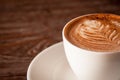 Closeup of a fresh cup of coffee with milk froth Royalty Free Stock Photo