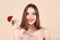 Closeup fresh face girl. Fashion portrait of young beautiful woman with naked shoulder and red rose. Beauty spring. Royalty Free Stock Photo