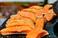 Closeup of a fresh fillet of salmon on hot grill