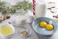 Closeup of fresh ingredients for eggnog.Concept of process of making traditional Christmas drink.Bottle of milk, jar of sugar, bro Royalty Free Stock Photo