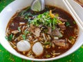 Closeup of fresh noodles soup with pork and its tasty thick broth Guay Tiao Nam Tok Moo