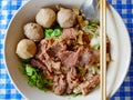 Closeup of fresh noodles soup with stewed beef Guay Tiao Nuea - delicious and healthy street food in Thailand