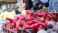 Closeup of fresh Piquillo peppers at an outdoor market