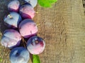 Closeup of fresh ripe plums on a wooden background. Copy space. Fruit background Royalty Free Stock Photo