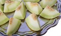 Closeup of fresh slices of yellow melon or cantaloupe on the old Royalty Free Stock Photo