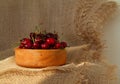 Closeup of fresh tasty cherries in wooden bowl. Rustic style dessert Royalty Free Stock Photo