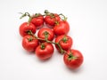 Closeup of fresh tomatoes on the vine isolated on white Royalty Free Stock Photo