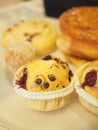 Closeup of freshly baked vanilla cupcakes on a table Royalty Free Stock Photo