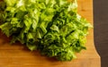 Closeup of freshly cut lettuce on a wooden cutting board