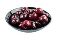 Closeup of freshly washed ripe cherries in a black bowl isolated on white background Royalty Free Stock Photo