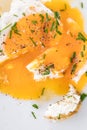 Closeup, fried egg with chives, liquid and fluidly egg yolk