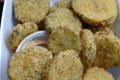 Closeup of fried pickles with cocktail dip