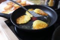 Closeup of fried potato pancakes in frying pan Royalty Free Stock Photo