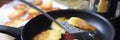 Closeup of fried potato pancakes in frying pan Royalty Free Stock Photo