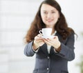 Closeup.friendly business woman with a Cup of coffee