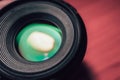 Closeup front camera glass lens with multi coat green tint Royalty Free Stock Photo
