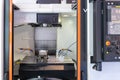 Closeup front view of numerically controlled machine tool Royalty Free Stock Photo