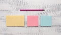 Closeup front view three multicolor blank notepads message marker pen ballpoint wooden vintage background empty text