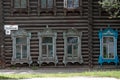 Closeup front view of a traditional wooden house with windows in Tomsk, Russia