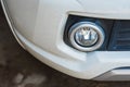 Closeup of front view of a white car modern technology head light with xenon lamp Royalty Free Stock Photo