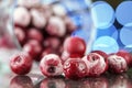 Closeup of the frozen cherry in the glass reflecting on the surface Royalty Free Stock Photo