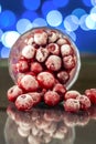 Closeup of the frozen cherry in the glass reflecting on the surface Royalty Free Stock Photo