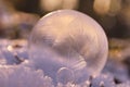 Closeup of a frozen crystal ball in an icy environment