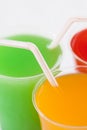 Closeup fruity drinks with straws