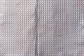 Closeup full-frame background and texture of aluminum coated butil rubber sheet with square pattern. Royalty Free Stock Photo